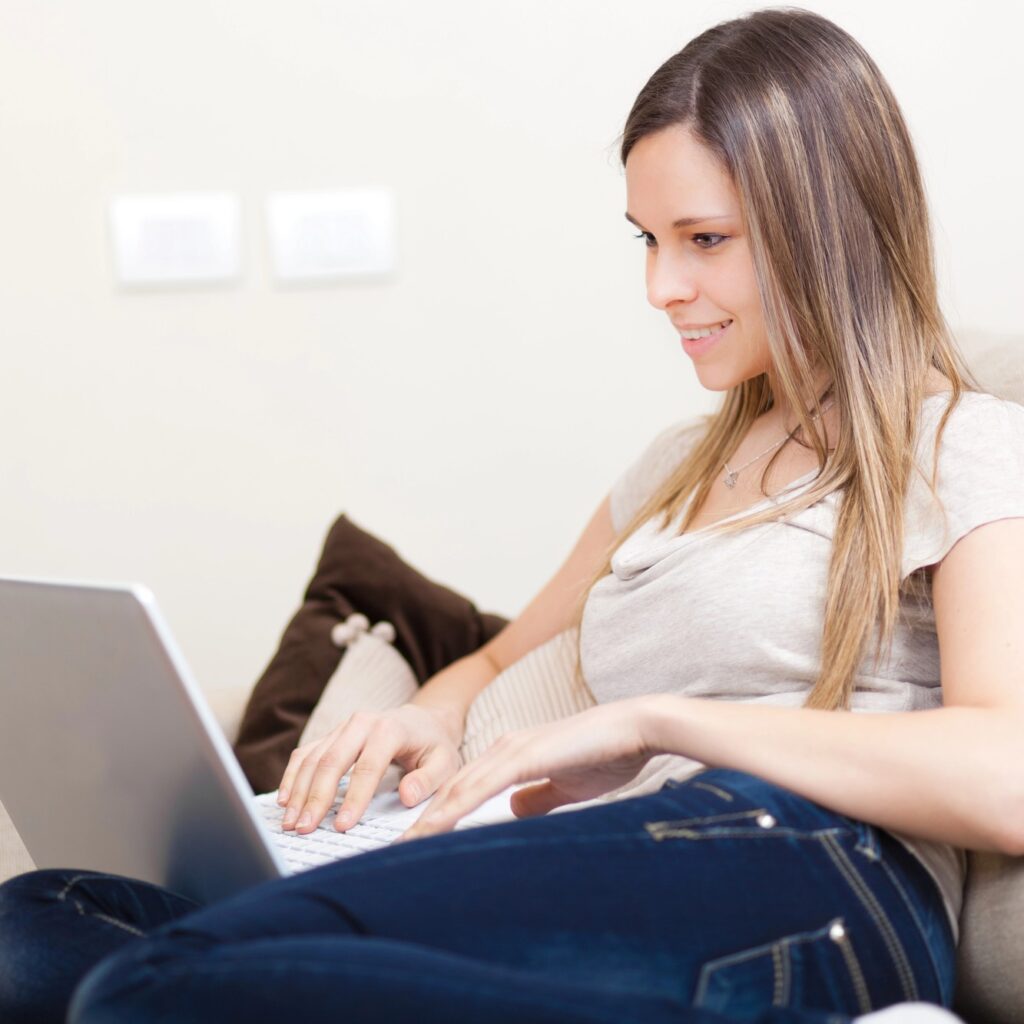 woman-writing-newsletter-on-laptop