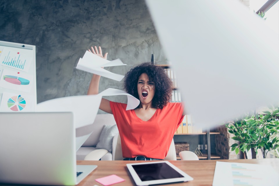 female-entrepreneur-throwing-analytics-reports