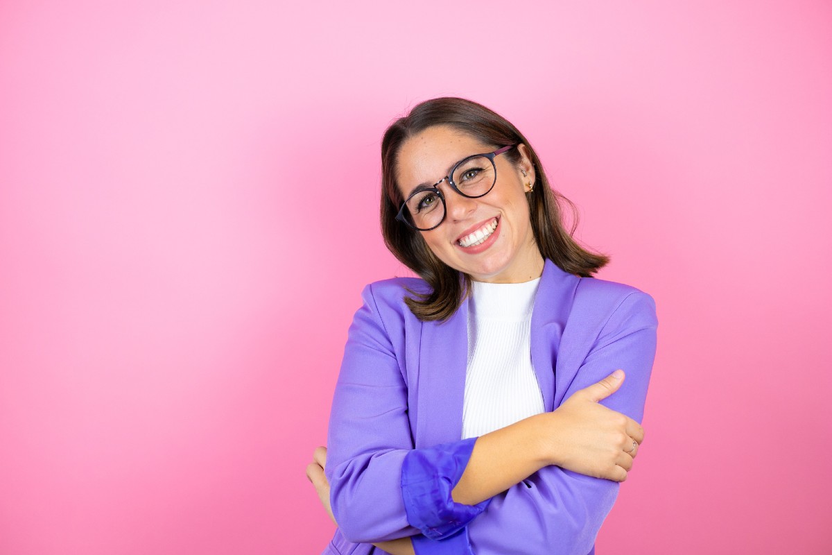 Female business coach celebrating AI search success after implementing first-person E-E-A-T content strategy