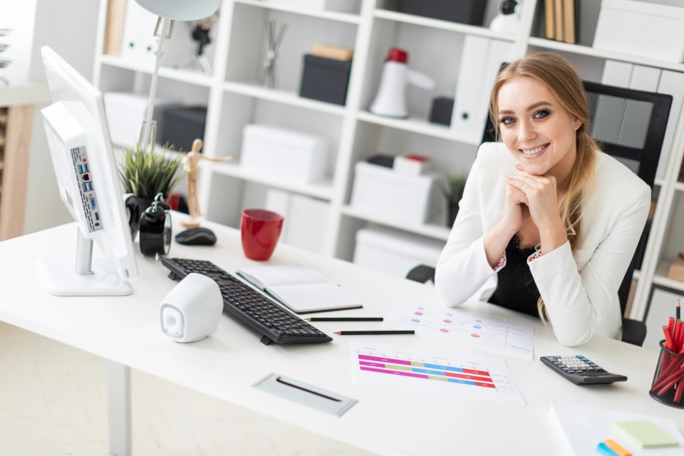 Female business owner reviewing her GEO audit results to improve AI search visibility without social media marketing