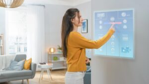 woman operating modern wall screen technology
