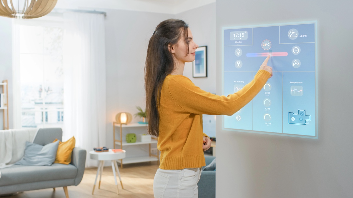 woman operating modern wall screen technology