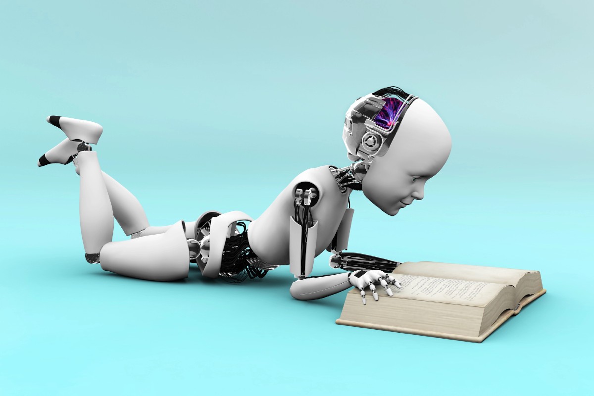 Robot with artificial intelligence reading a book, representing how AI systems parse and understand website content through schema markup for better search visibility